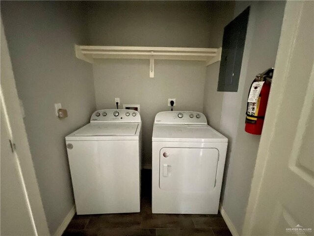 clothes washing area with washing machine and dryer