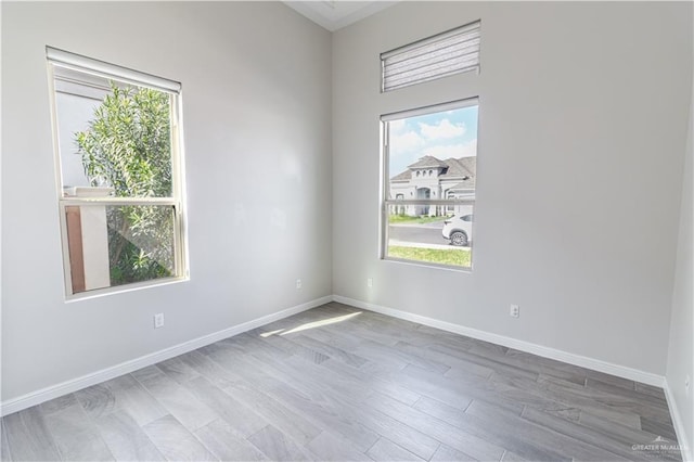 spare room with hardwood / wood-style flooring