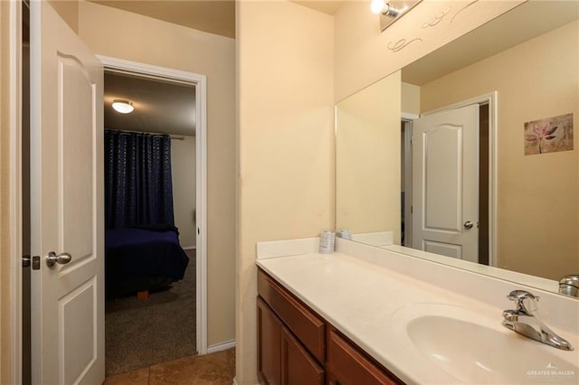 bathroom with tile patterned floors, a shower with curtain, and vanity