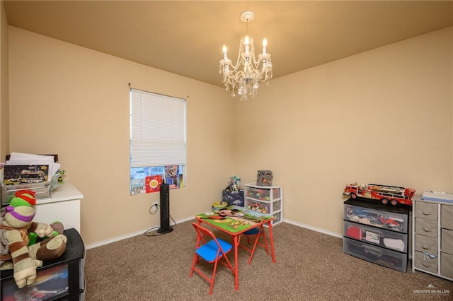 playroom with carpet and an inviting chandelier