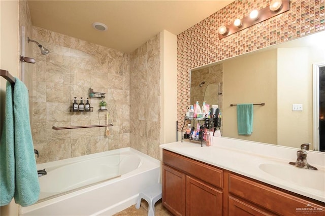 bathroom with vanity and tiled shower / bath