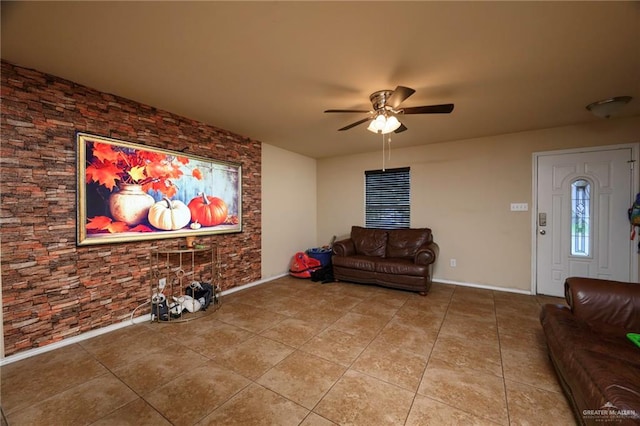 living room with light tile patterned floors and ceiling fan