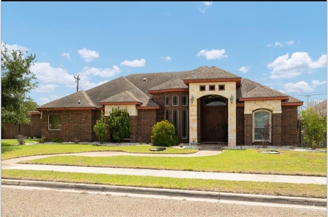 1336 Loretta Lynn Dr, Edinburg, TX 78541 - view of front of home featuring a front yard and brick siding