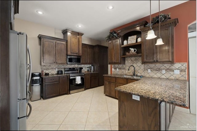 1336 Loretta Lynn Dr, Edinburg, TX 78541 - kitchen featuring stainless steel appliances, a peninsula, open shelves, backsplash, and light tile patterned floors
