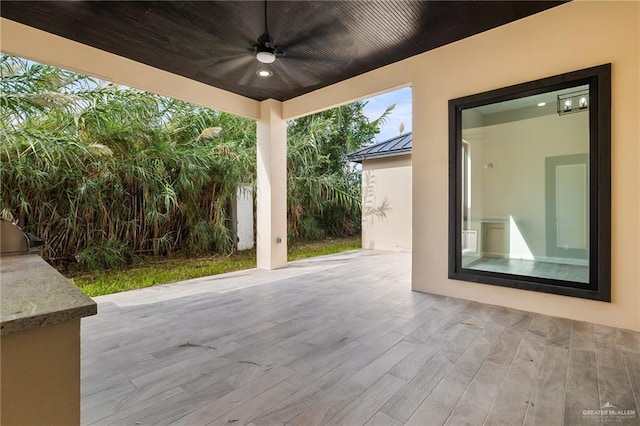 view of patio / terrace featuring ceiling fan