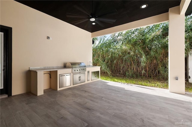 view of patio / terrace featuring grilling area, ceiling fan, sink, and area for grilling