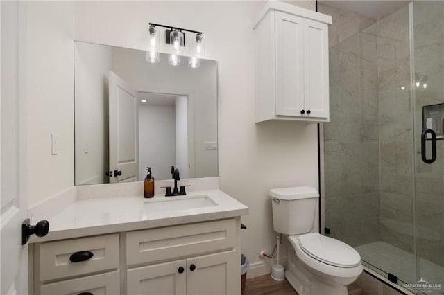 3101 E Iverson Ave, Edinburg, TX 78542 - full bathroom with a shower stall, toilet, vanity, and baseboards