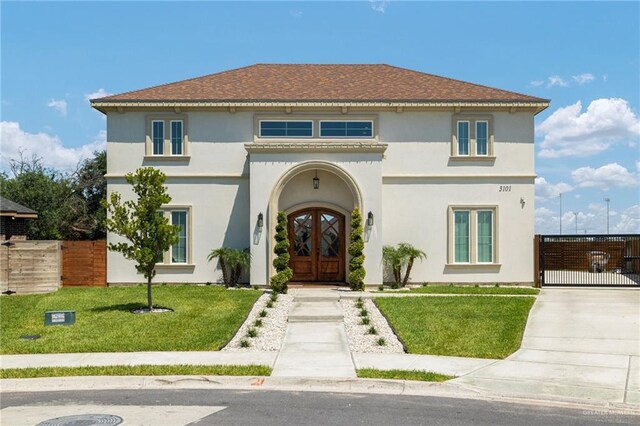 3101 E Iverson Ave, Edinburg, TX 78542 - mediterranean / spanish-style home featuring a gate, french doors, stucco siding, and a shingled roof