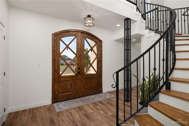 3101 E Iverson Ave, Edinburg, TX 78542 - entrance foyer with baseboards, wood finished floors, stairs, and recessed lighting