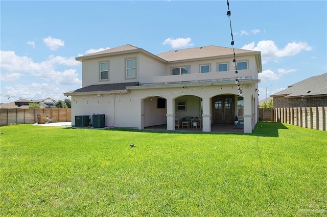 3101 E Iverson Ave, Edinburg, TX 78542 - rear view of house with a patio area, stucco siding, and central air condition unit