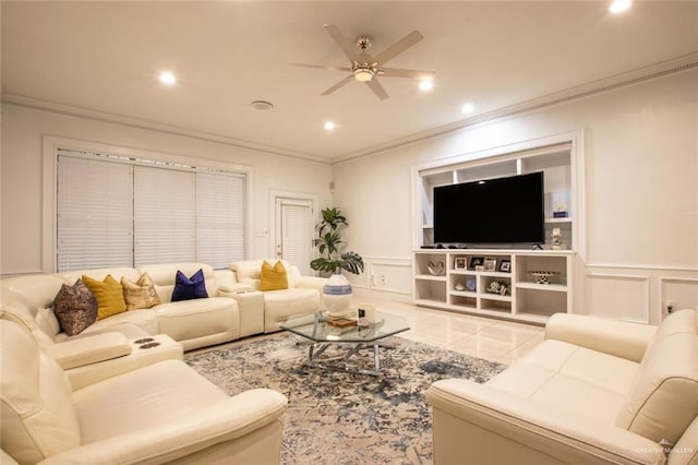 tiled living room with ceiling fan and ornamental molding