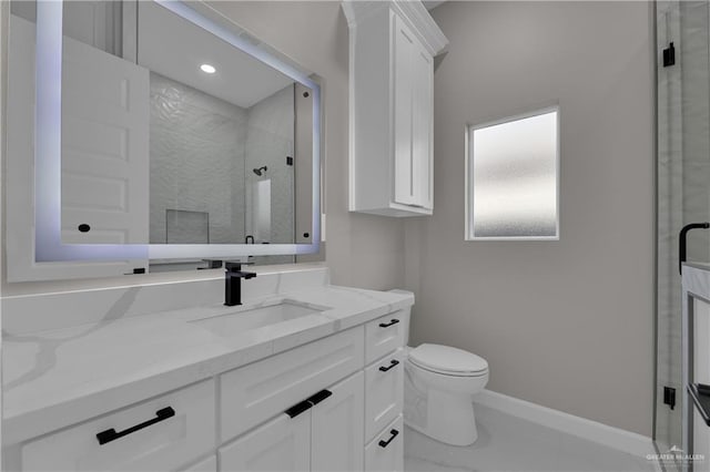 bathroom with vanity, toilet, and an enclosed shower