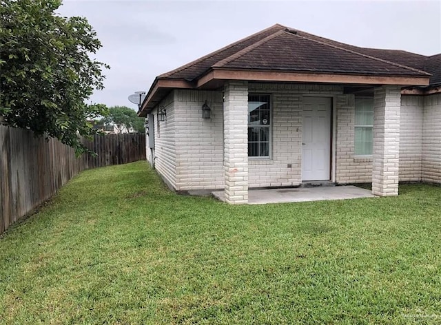 4103 S Veterans Blvd, Edinburg, TX 78542 - rear view of house with brick siding and a shingled roof