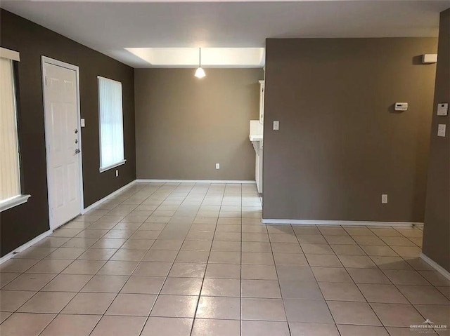 4103 S Veterans Blvd, Edinburg, TX 78542 - empty room featuring light tile patterned flooring and baseboards