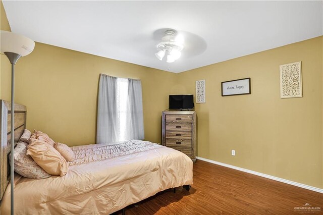 bedroom featuring ceiling fan and wood-type flooring