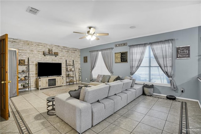 tiled living room featuring ceiling fan