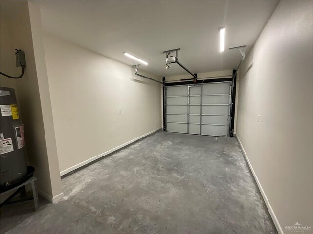 3503 Emma Dr, Weslaco, TX 78596 - garage featuring a garage door opener, water heater, and baseboards