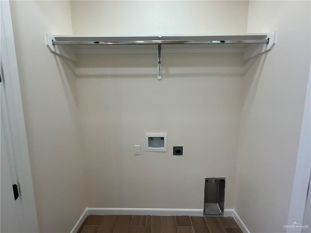 3503 Emma Dr, Weslaco, TX 78596 - washroom featuring washer hookup, hookup for an electric dryer, baseboards, and dark wood-style flooring