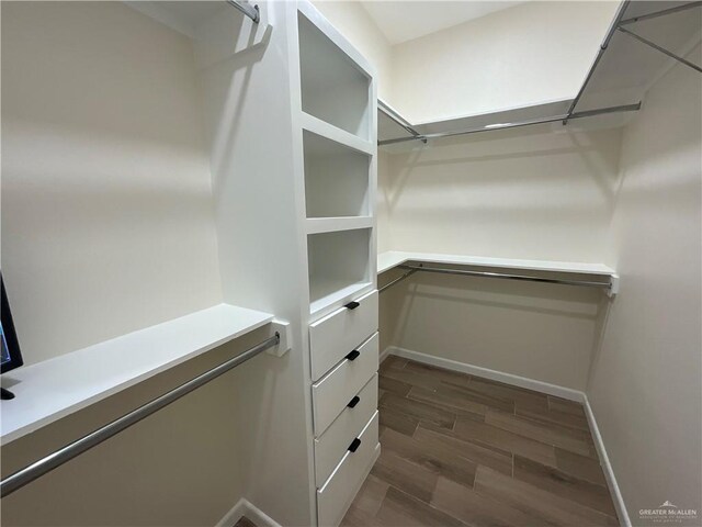 3503 Emma Dr, Weslaco, TX 78596 - spacious closet with dark wood-style floors