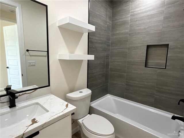 3503 Emma Dr, Weslaco, TX 78596 - bathroom featuring vanity, toilet, and bathtub / shower combination