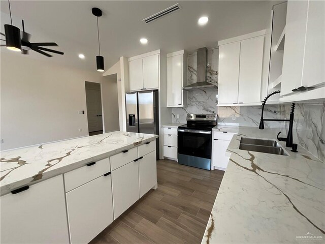 3503 Emma Dr, Weslaco, TX 78596 - kitchen with wall chimney exhaust hood, stainless steel appliances, a sink, recessed lighting, and a ceiling fan
