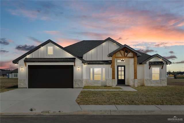 modern farmhouse with an attached garage, a standing seam roof, board and batten siding, and concrete driveway