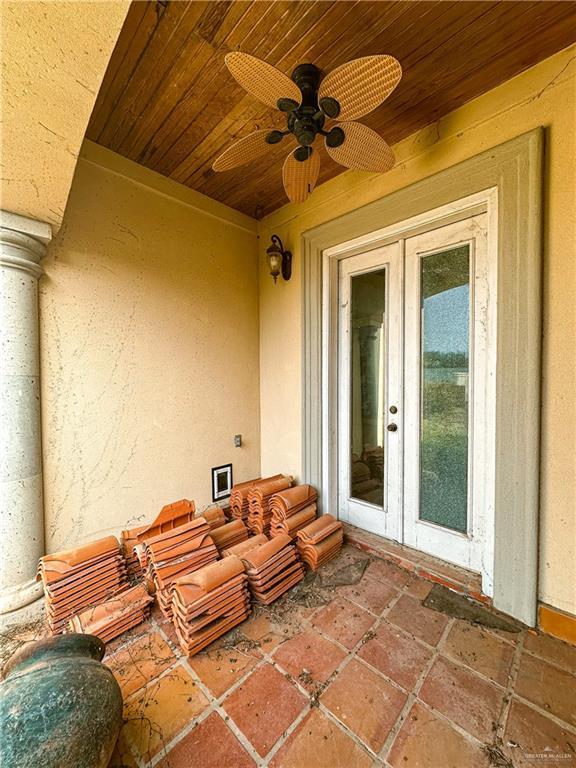 view of patio featuring french doors and ceiling fan