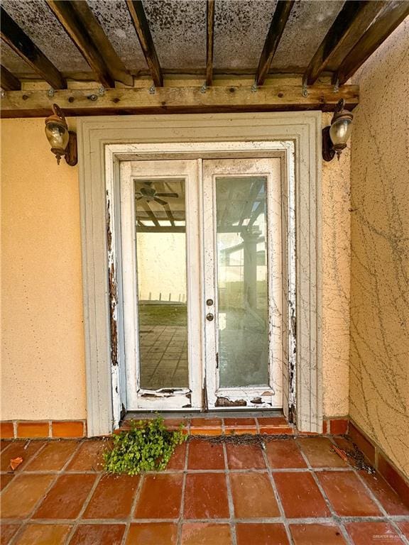 entrance to property featuring french doors