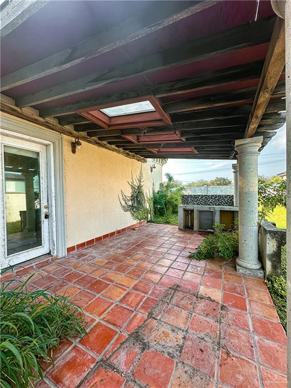 view of patio featuring an outbuilding