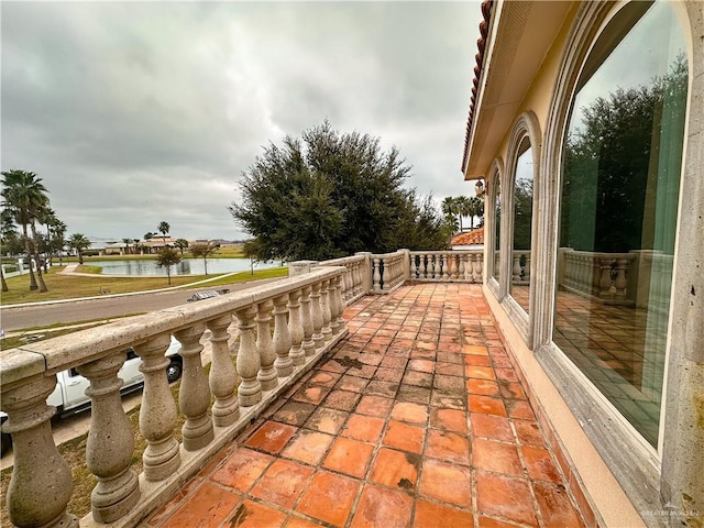 balcony featuring a water view