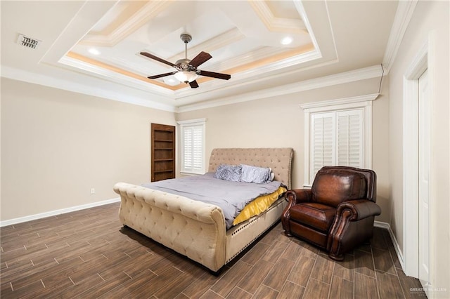 bedroom featuring a tray ceiling, crown molding, and ceiling fan