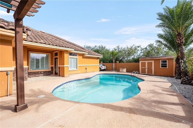 view of swimming pool with a storage unit and a patio area