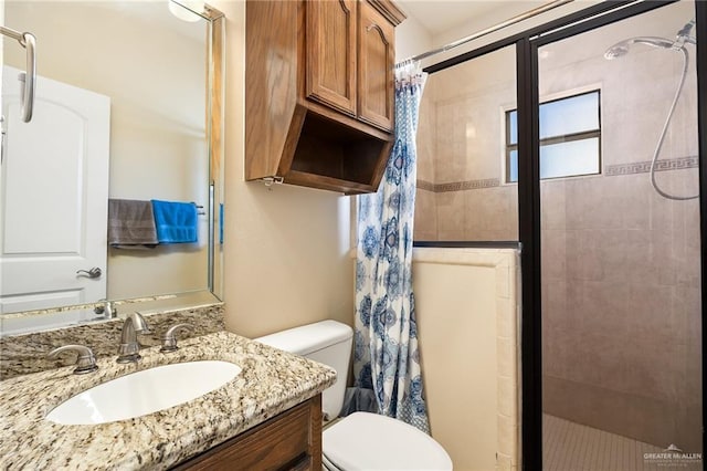 bathroom with vanity, toilet, and a shower with curtain