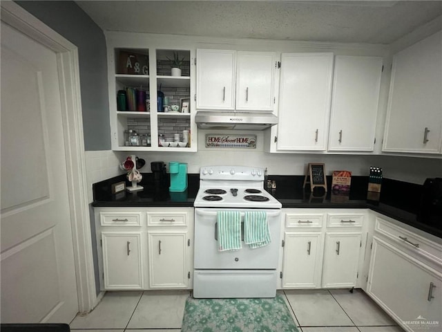 kitchen with white cabinets, white electric range oven, and light tile patterned floors