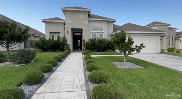 5016 Kendlewood Ave, Mcallen, TX 78501 - contemporary home with a front lawn, an attached garage, and driveway