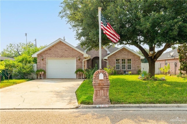 single story home featuring fence, an attached garage, driveway, brick siding, and a front yard
