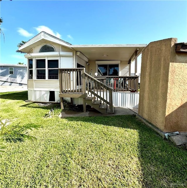 379 Sand Dollar Dr, Port Isabel, TX 78578 - rear view of property with a yard