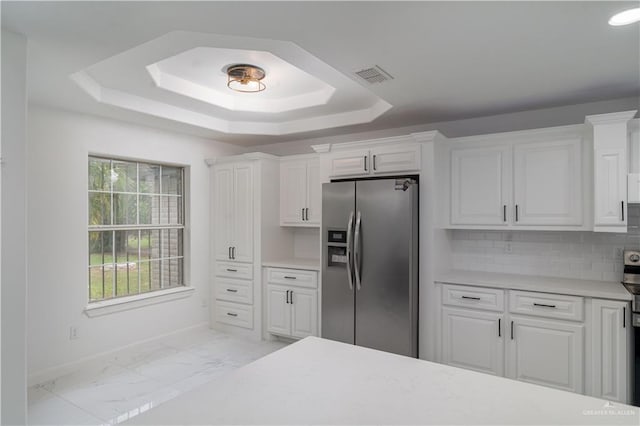 kitchen featuring white cabinets and appliances with stainless steel finishes