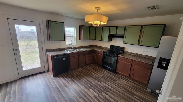 kitchen featuring hanging light fixtures, plenty of natural light, sink, and black appliances