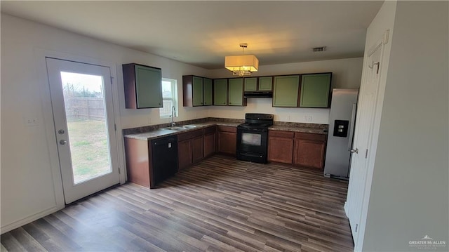 kitchen featuring black range with electric stovetop, decorative light fixtures, stainless steel refrigerator with ice dispenser, sink, and wood-type flooring