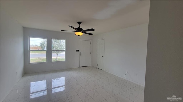 spare room with ceiling fan