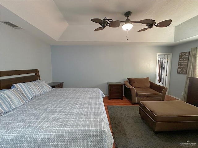 bedroom with hardwood / wood-style flooring and ceiling fan