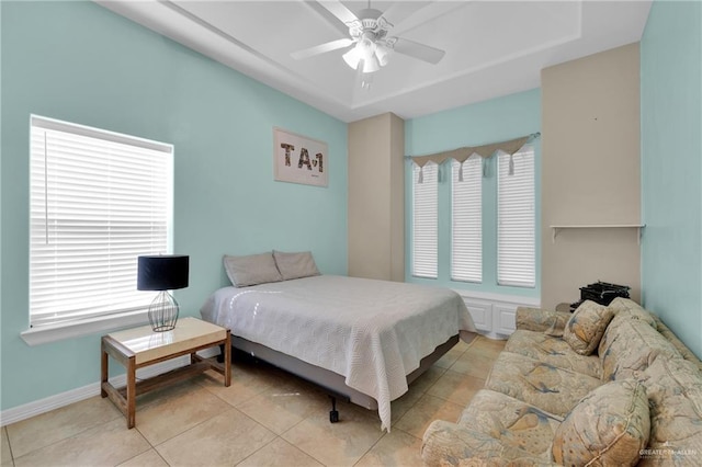 tiled bedroom with ceiling fan