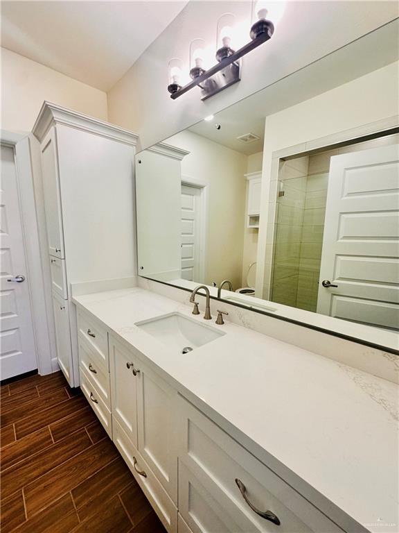 bathroom featuring vanity and walk in shower