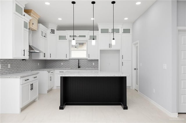905 Magnolia St, Mission, TX 78574 - kitchen featuring backsplash, a center island, a sink, decorative light fixtures, and recessed lighting