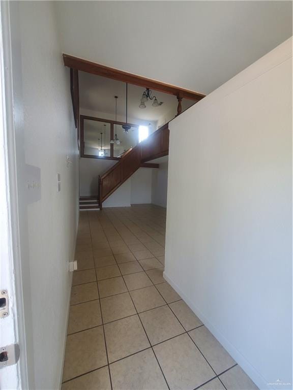 corridor featuring light tile patterned floors