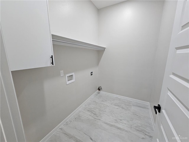 washroom featuring cabinets and washer hookup