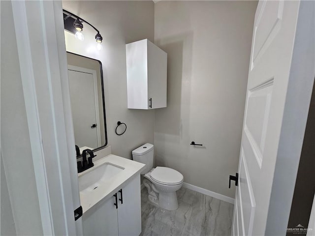 bathroom with toilet and vanity