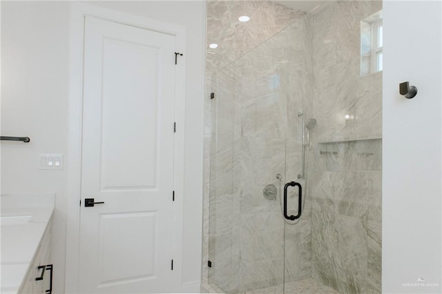 full bath featuring a stall shower and vanity