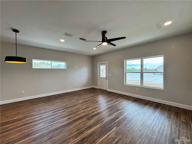1604 Monterrey Cir, Brownsville, TX 78526 - unfurnished room featuring dark wood-type flooring, a ceiling fan, and recessed lighting